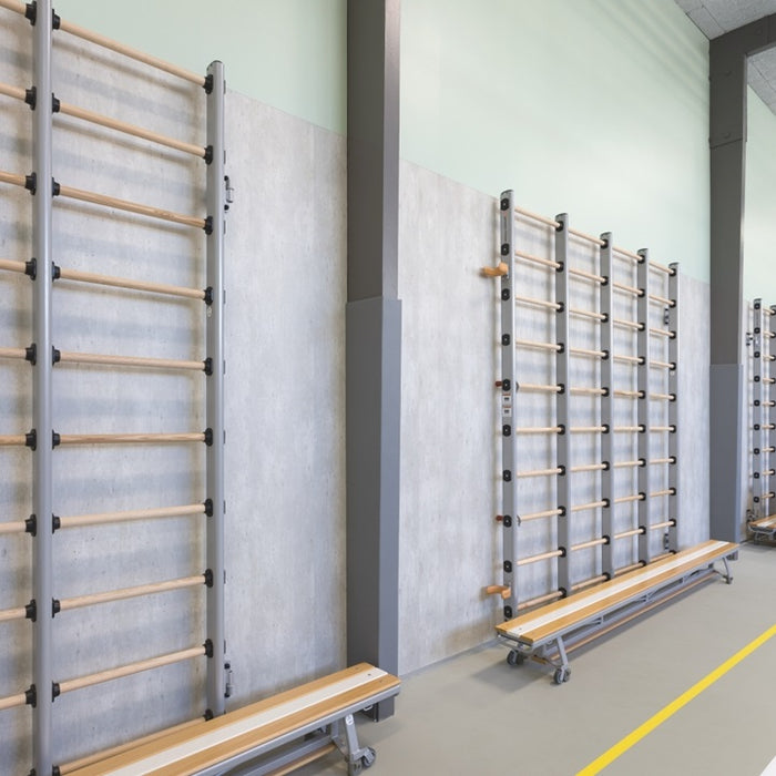 Wall-mounted storage racks with wooden shelves in a warehouse setting