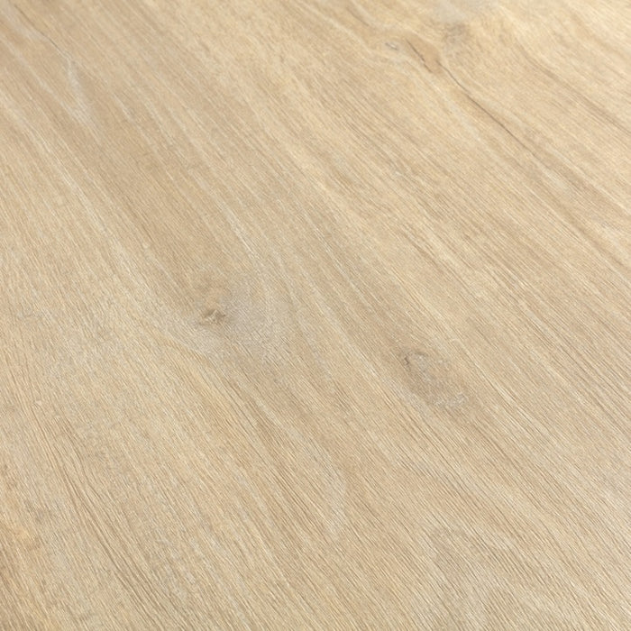 Close-up of a wooden surface with a light brown color and visible grain pattern.